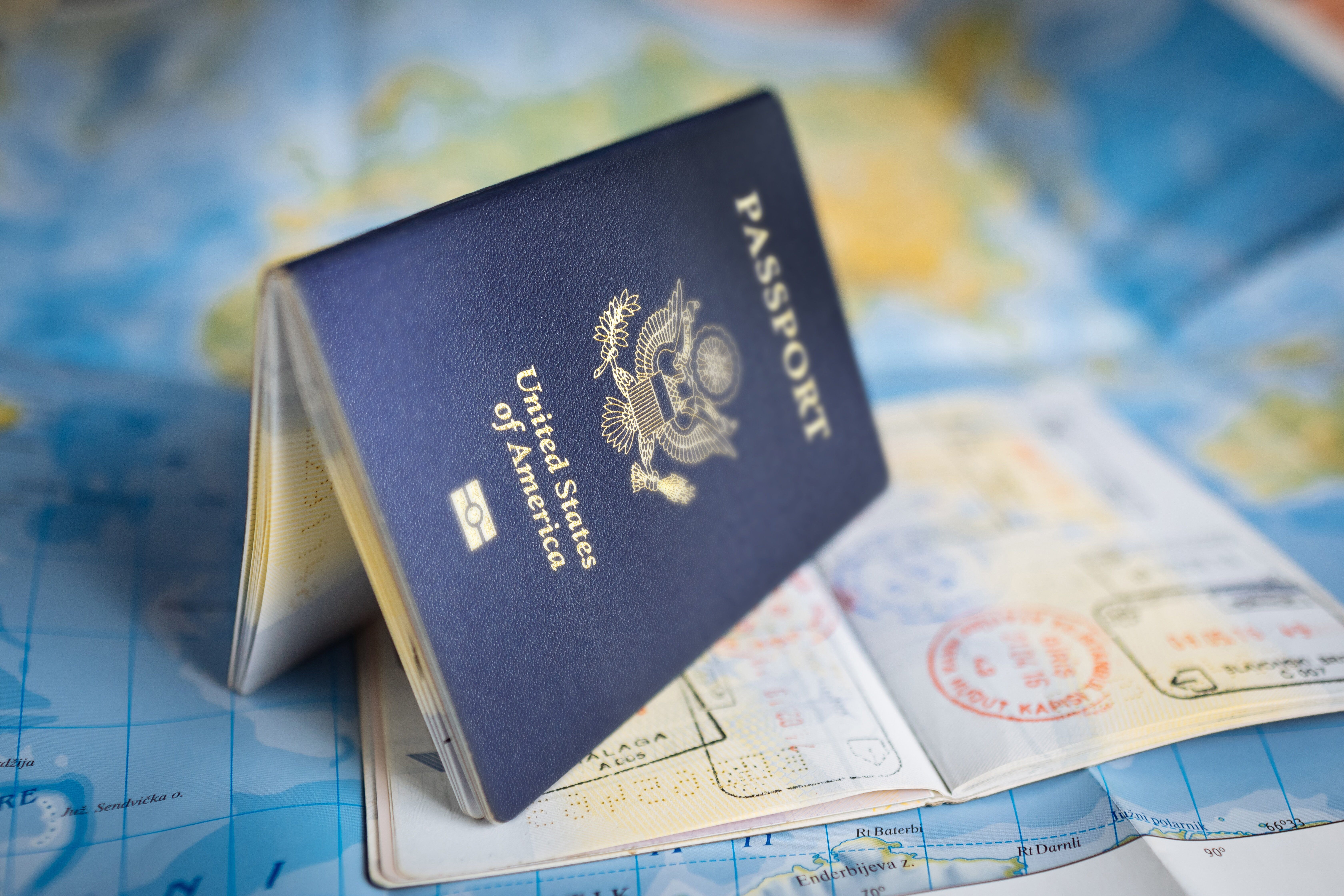 Can a Dual Citizen Change Status Using a Different Passport?